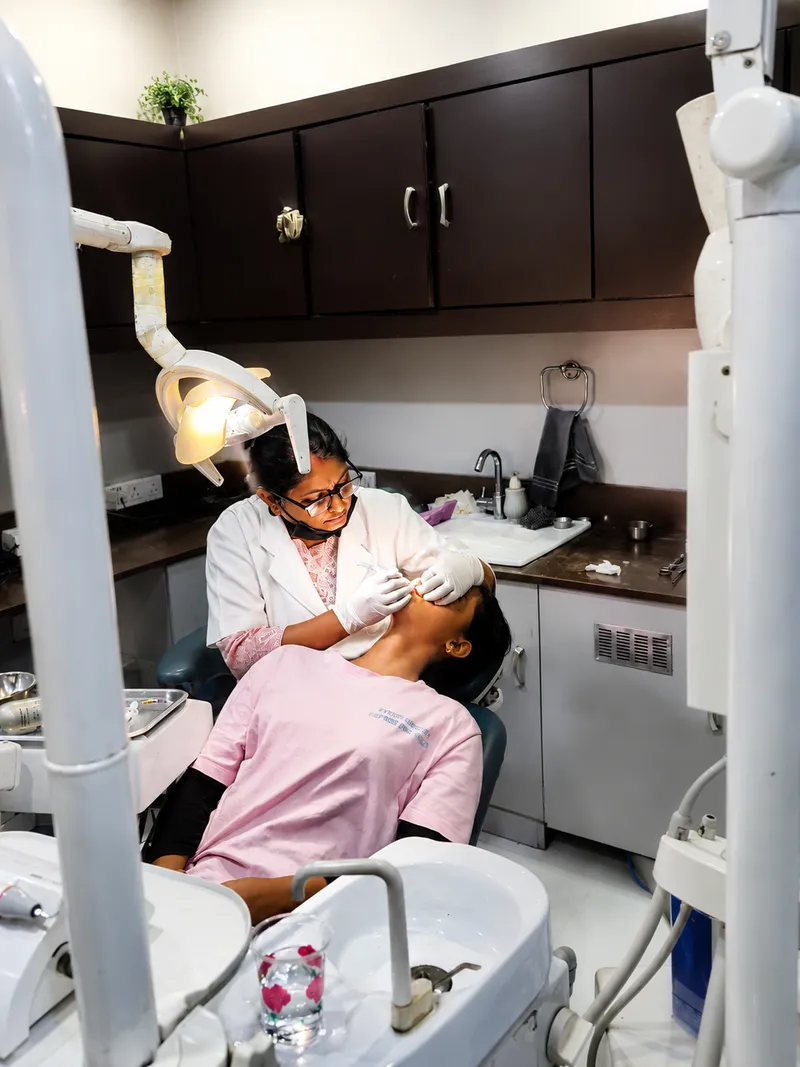 Dentist performing a dental examination at Sanjeevani Dental Clinic, Dimapur